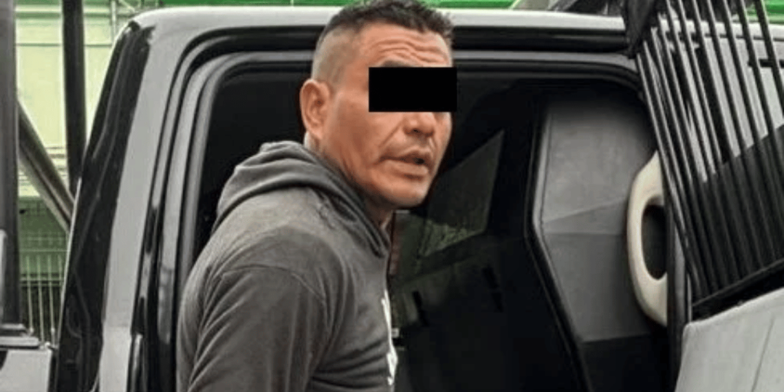 Man in a gray hoodie getting into a dark van or SUV; eyes are covered with a black bar for anonymity.